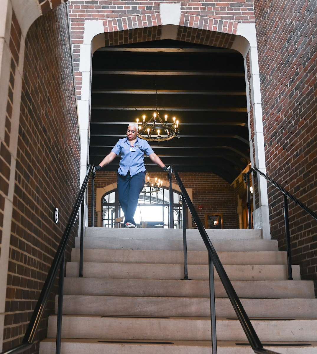 Carole Geter cleans in Founders Hall on March 18, 2020.