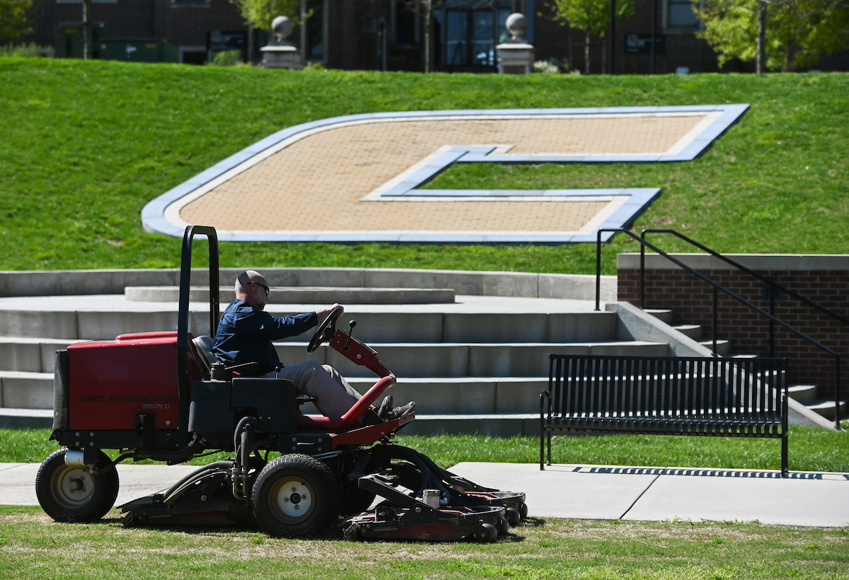 Chris Charland mows the grass on Chamberlain Field on April 2, 2020.