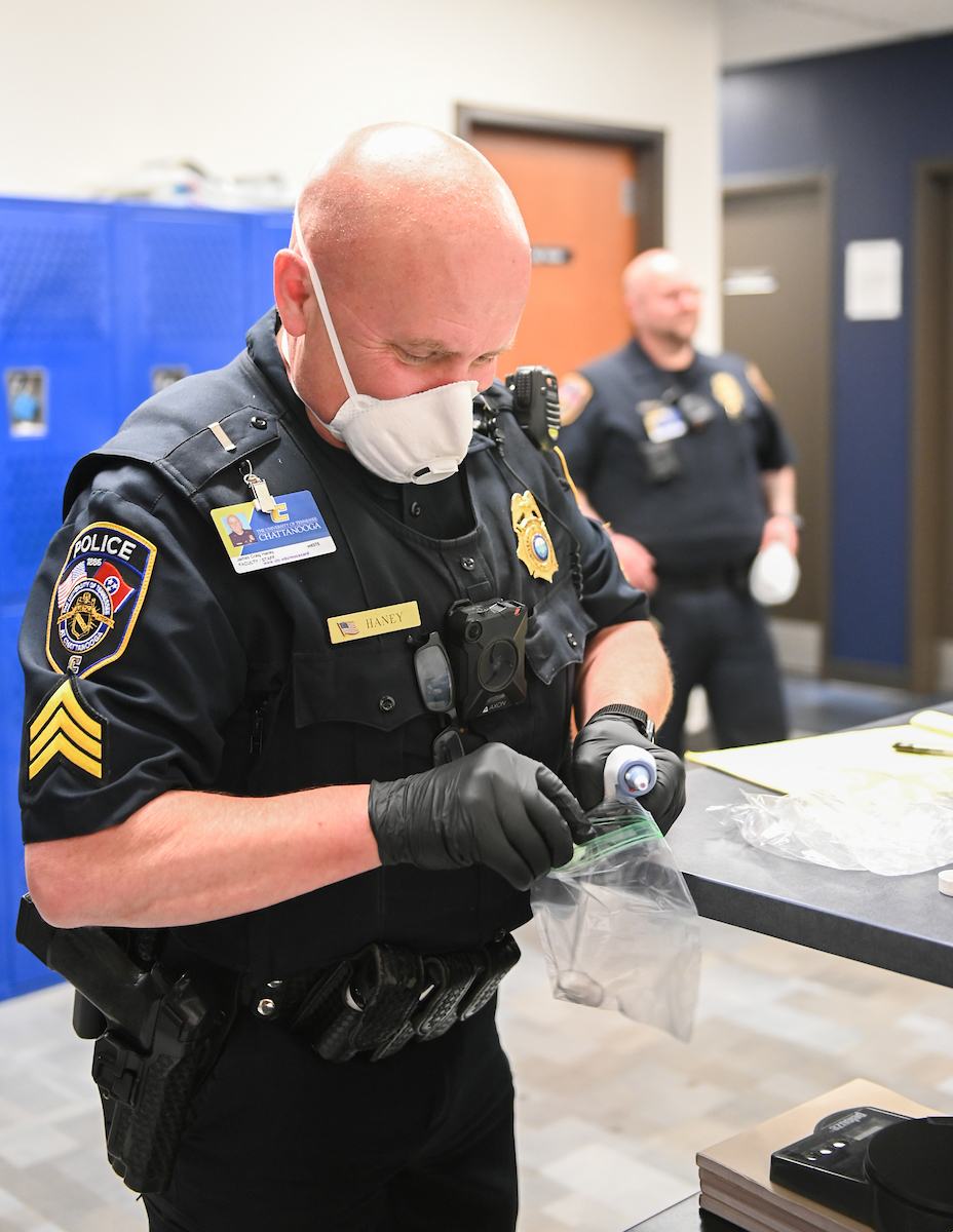UTC Police Sgt. Craig Haney works with a medical thermometer on April 2, 2020.