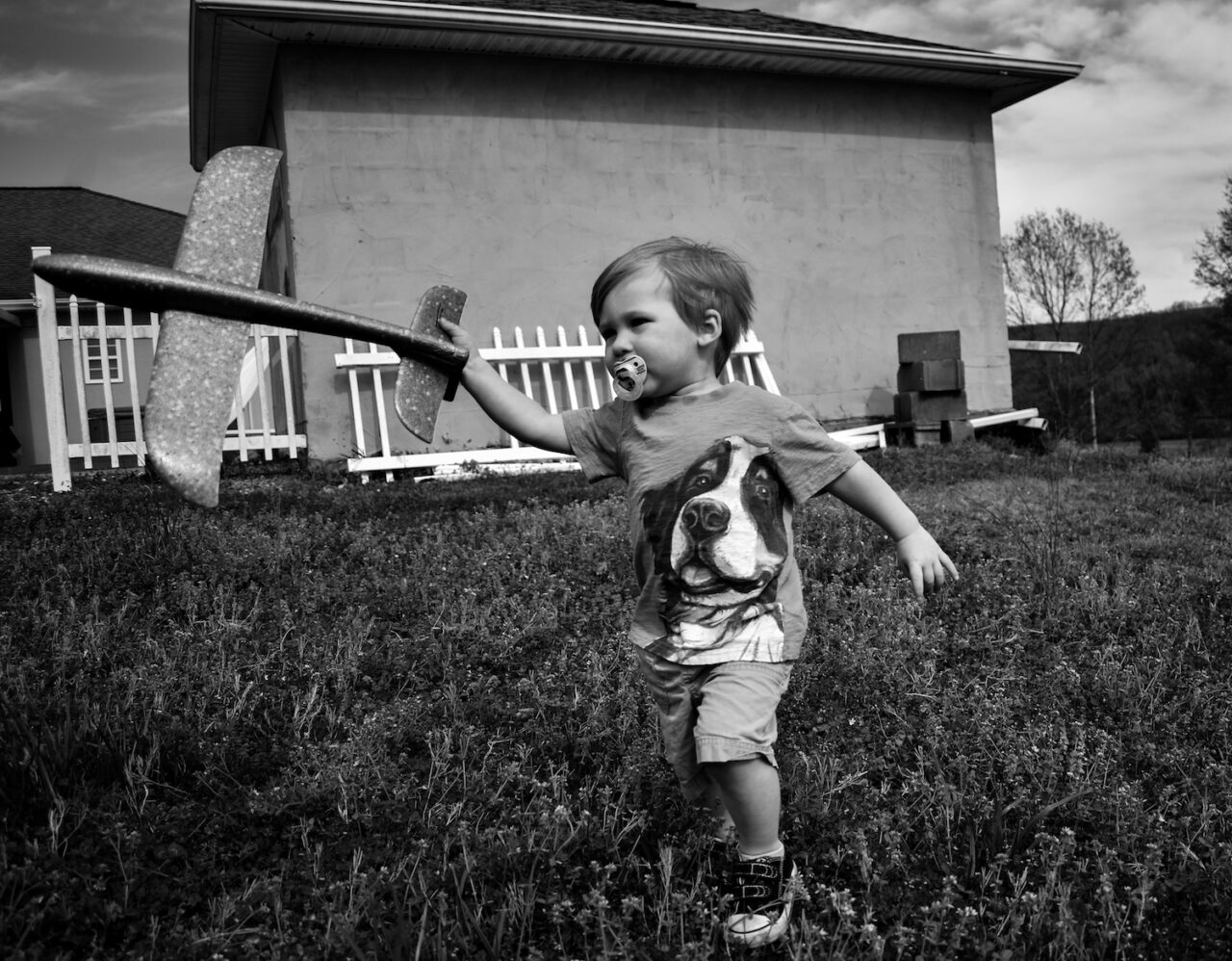 Tucker Jude Richardson flies a toy airplane in the backyard in Dunlap, Tennessee.TN on March 30, 2020.