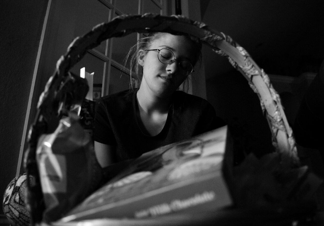 Tired in the early morning, Alivia Jade Fann sits with her eyes closed after finding her Easter basket on Sunday, April 12, 2020.