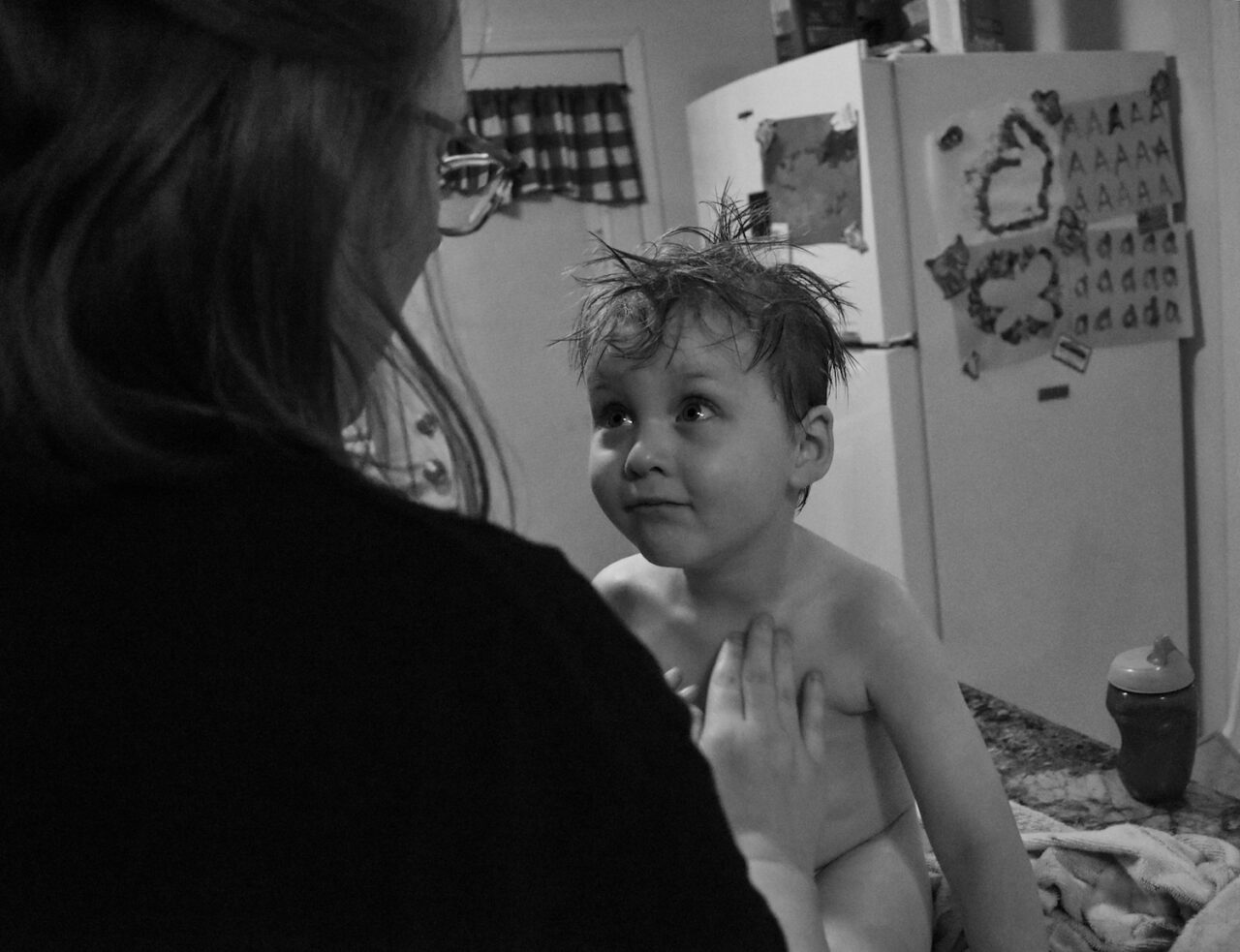 Fielder Lee Richardson intently talks to his Mom after bath time.