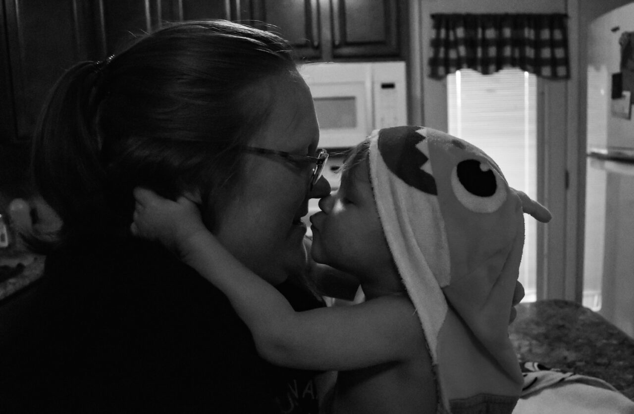 Tucker Richardson gives his Mom a kiss after bath time.