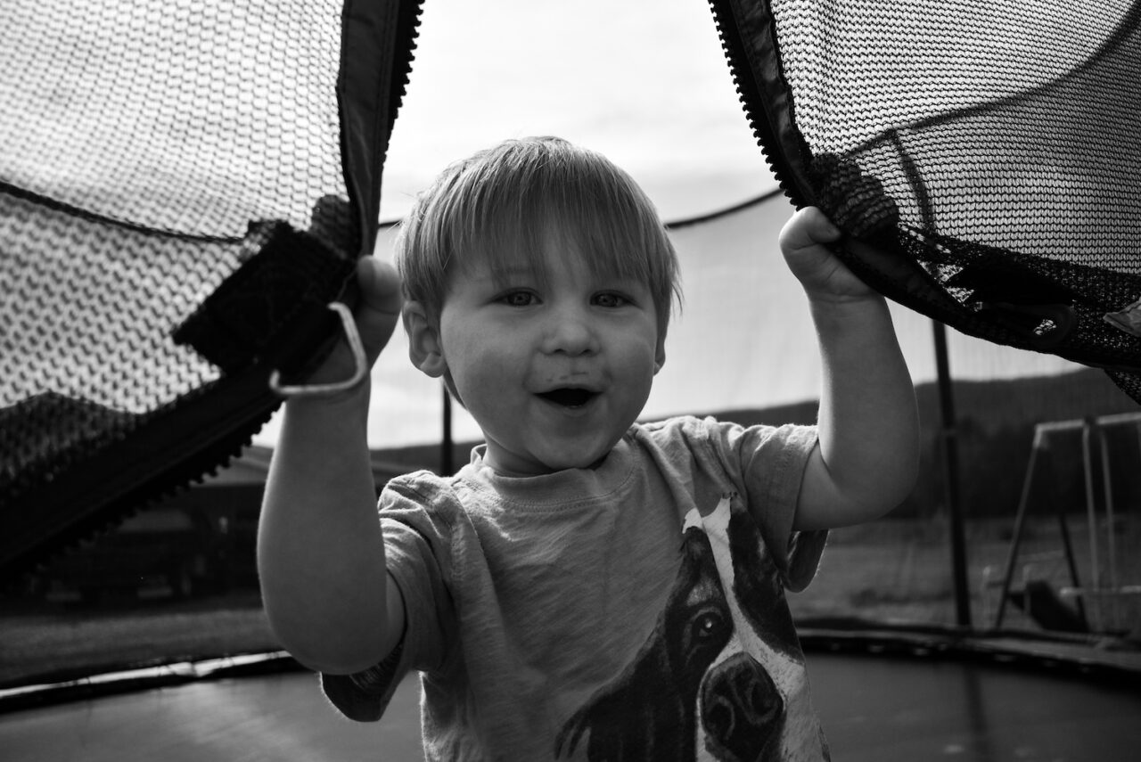 Tucker Jude Richardson laughs as he shuts Amanda Fann out of the trampoline.