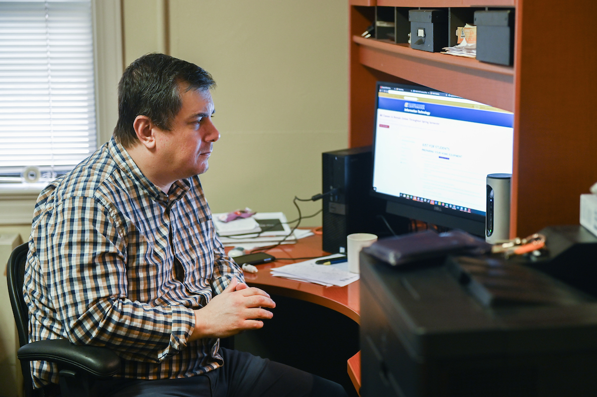 In his office, Tony Parsley, director of Client Services, talks remotely with Jeffrey Wetherill via Zoom on March 20, 2020, in Pfeiffer Hall.