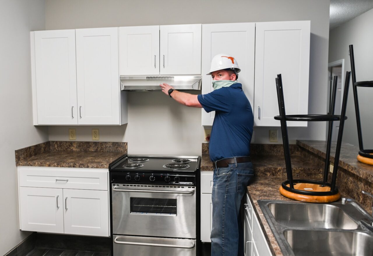 Project manager Marcus Willis points out some of the changes to kitchens.