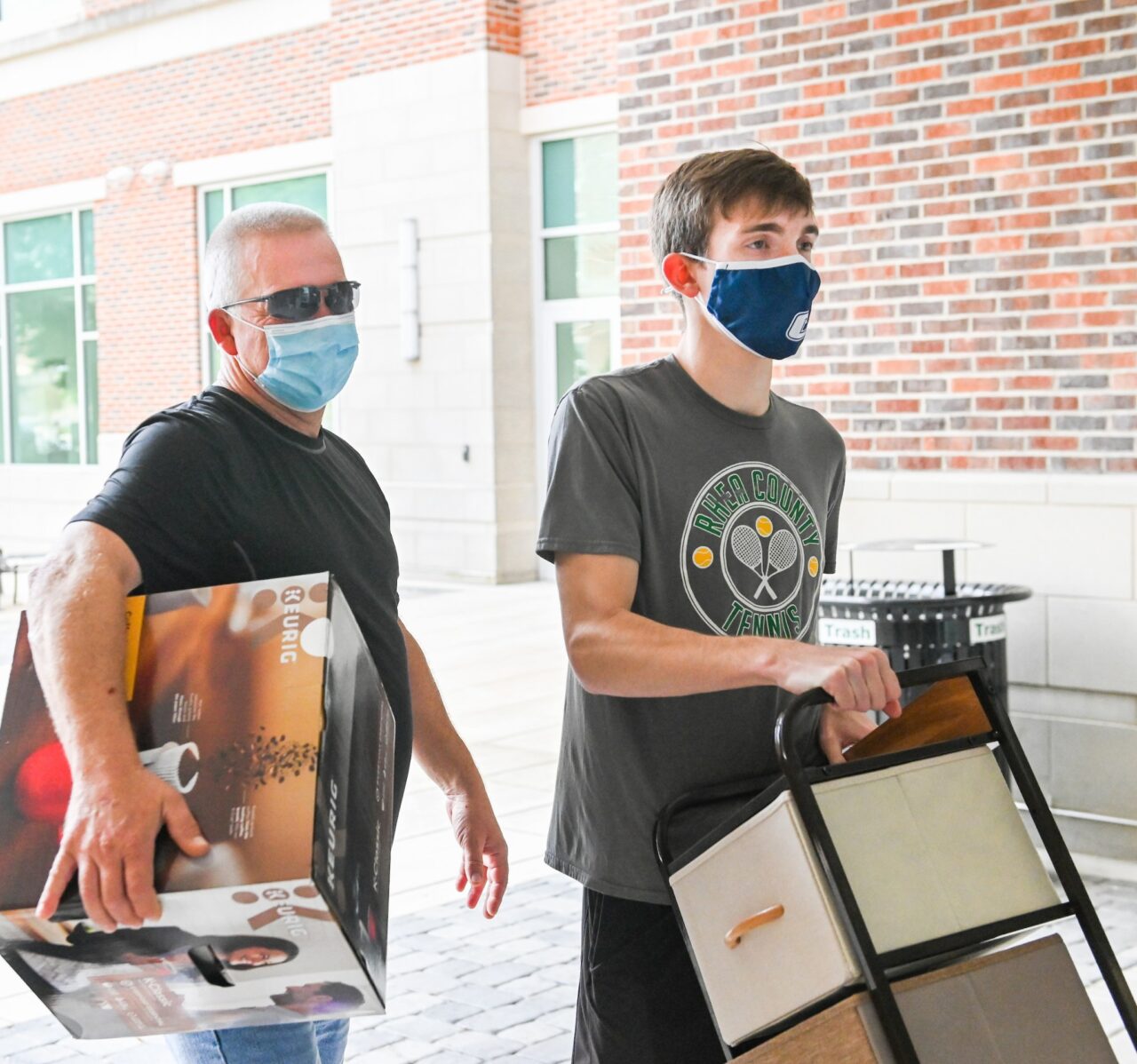 From Dayton, Tenn., Garrett Walker and his dad Richard haul items into West Campus Housing.