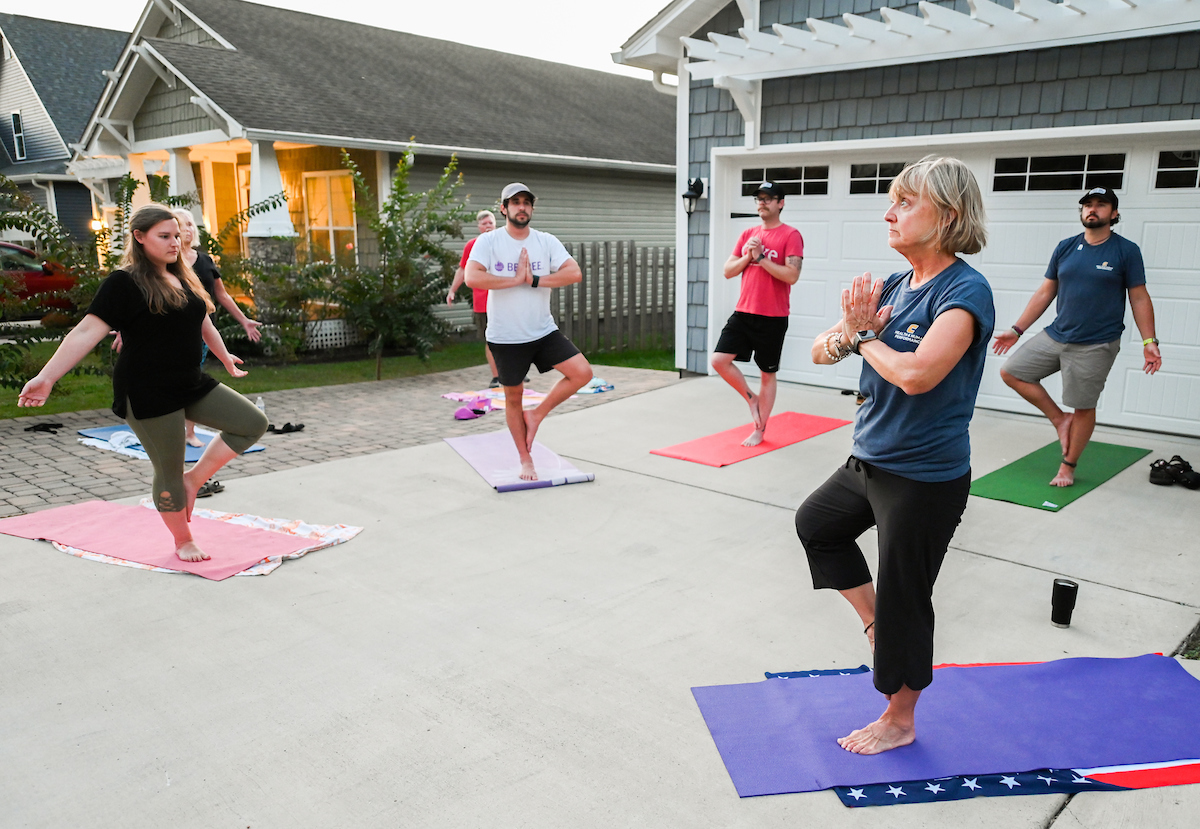 Jamie Harvey leads yoga Thursday, Oct. 22, 2020 in her driveway.