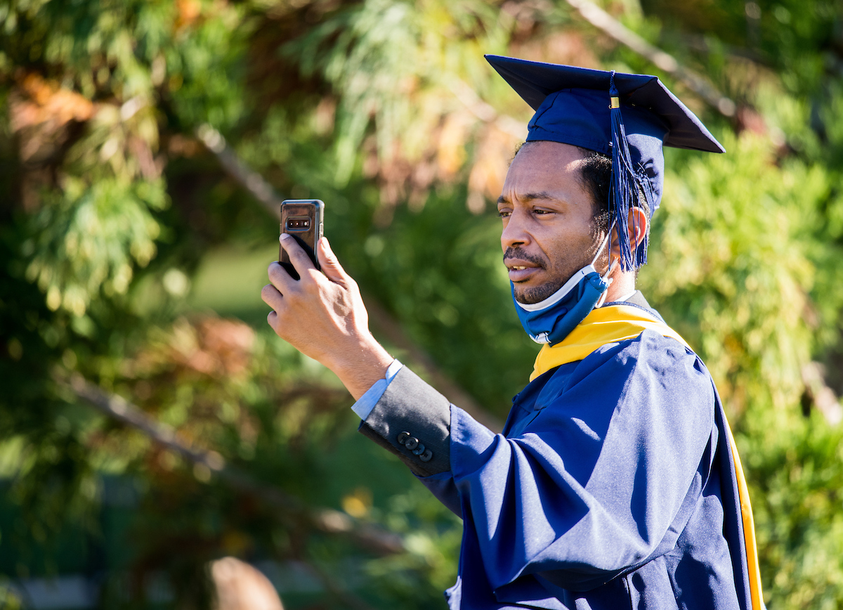 Graduate students participate in a commencement ceremony on Wednesday, Nov. 18, 2020.
