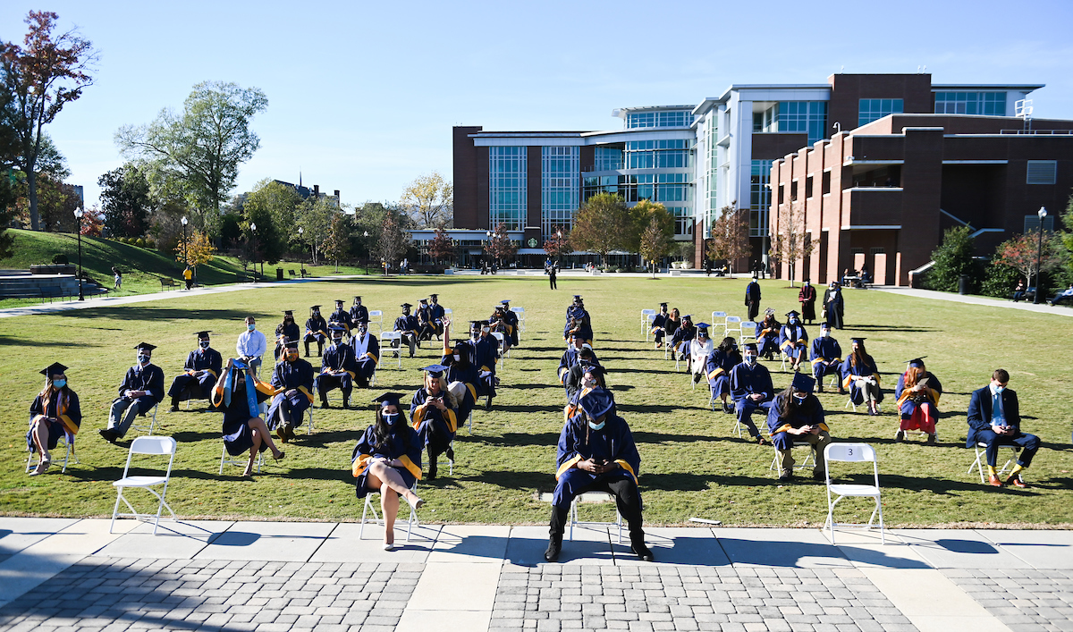 Undergraduate students participate in a commencement ceremony Thursday, Nov. 19, 2020 on Chamberlain Field.