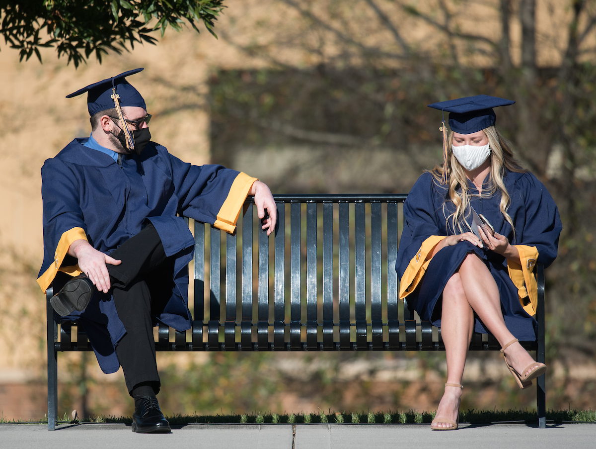 Undergraduate students participate in a commencement ceremony Thursday, Nov. 19, 2020 on Chamberlain Field.