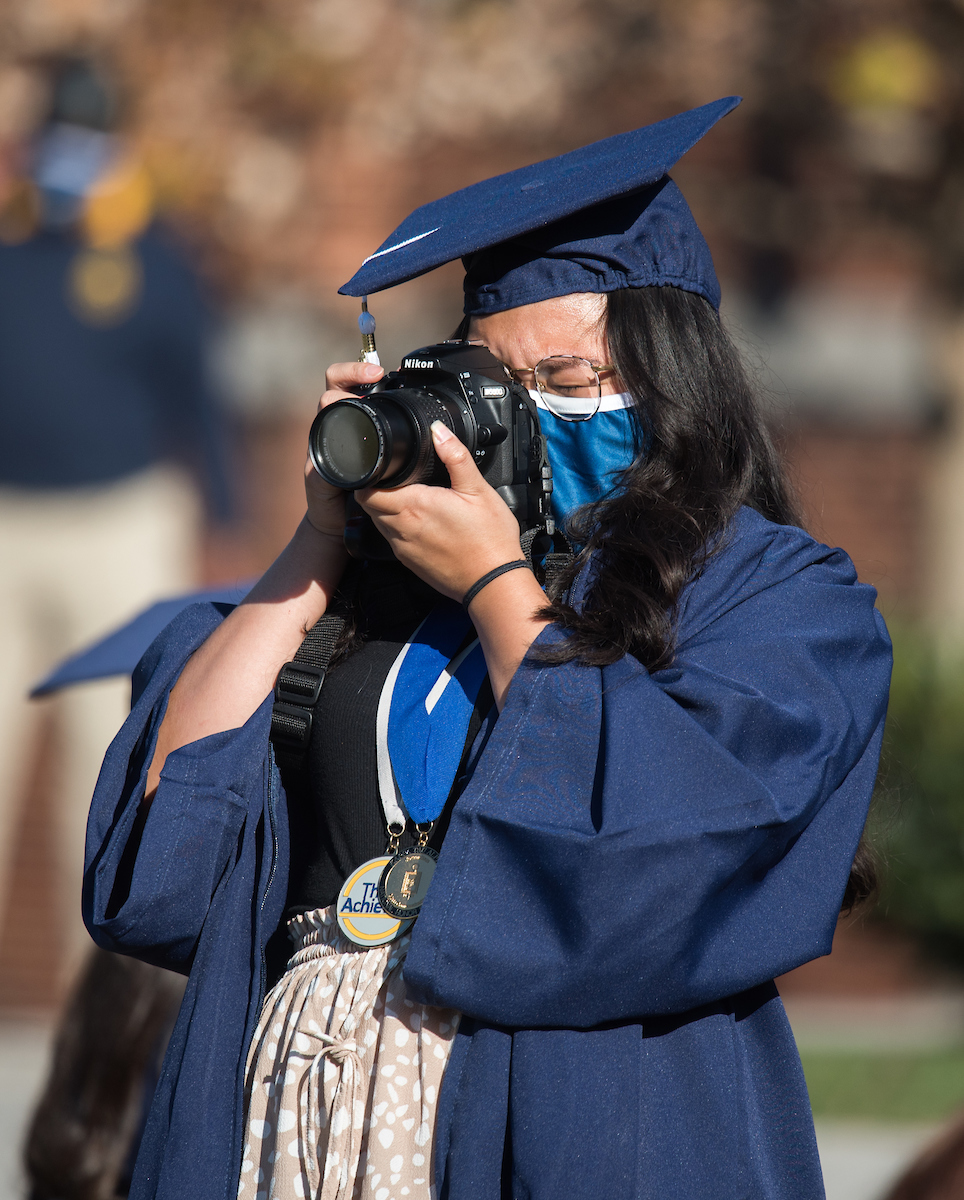 Undergraduate students participate in a commencement ceremony on Friday, Nov. 20, 2020 on Chamberlain Field.