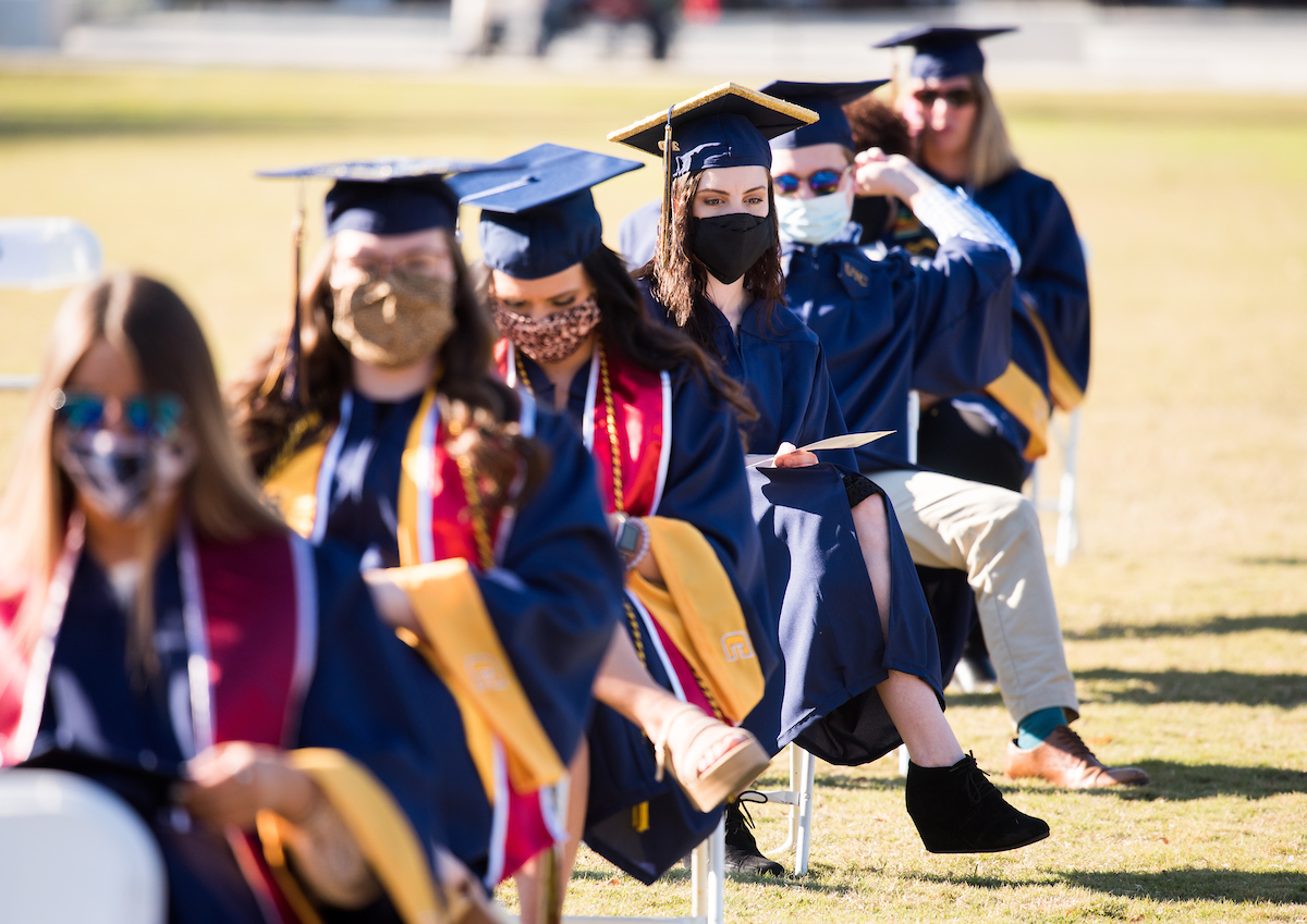 Undergraduate students participate in a commencement ceremony on Friday, Nov. 20, 2020 on Chamberlain Field.