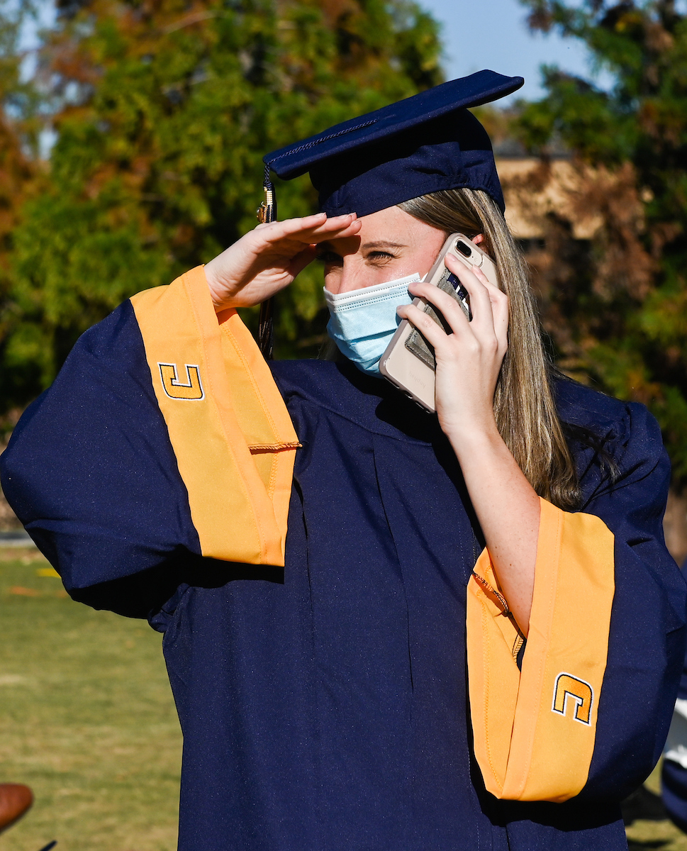 Undergraduate students participate in a commencement ceremony on Friday, Nov. 20, 2020 on Chamberlain Field.