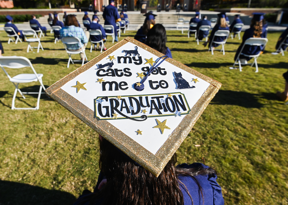 Undergraduate students participate in a commencement ceremony on Friday, Nov. 20, 2020 on Chamberlain Field.