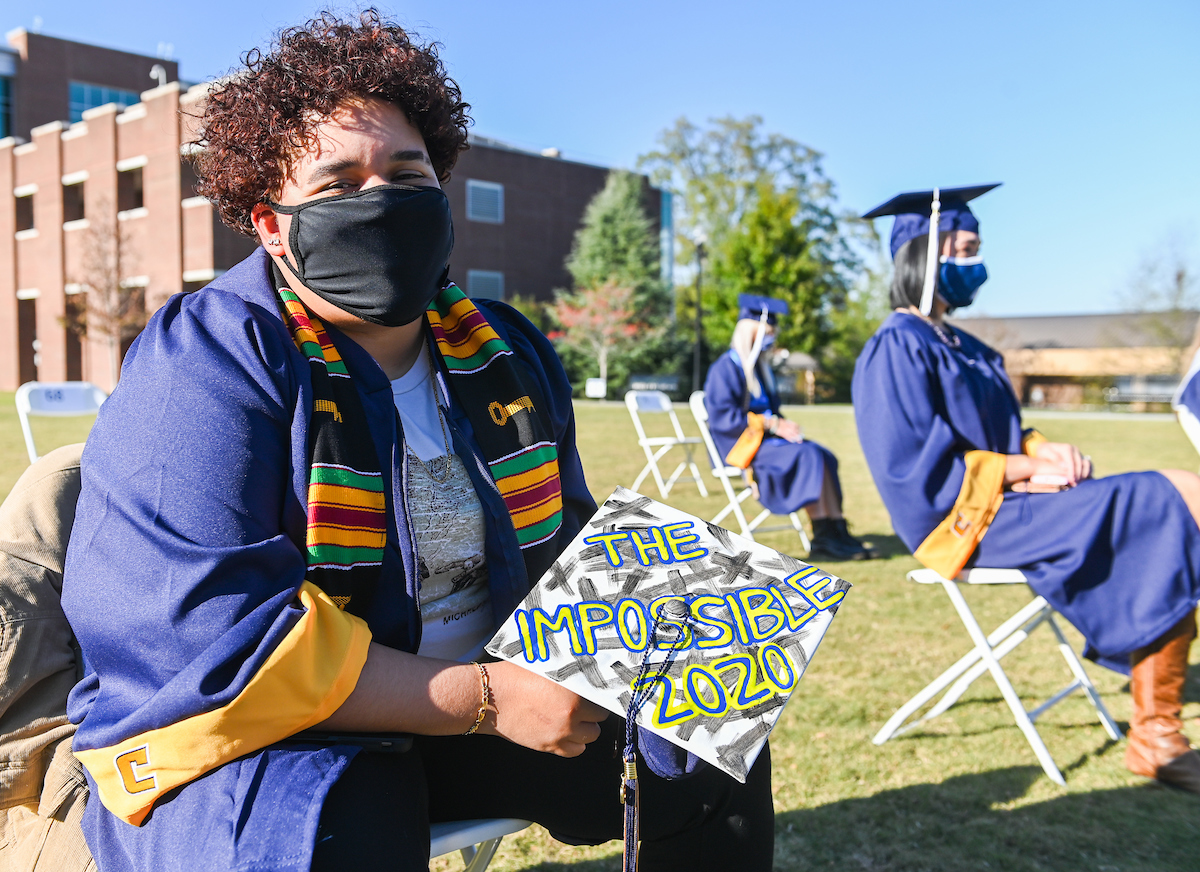 Undergraduate students participate in a commencement ceremony on Friday, Nov. 20, 2020 on Chamberlain Field.