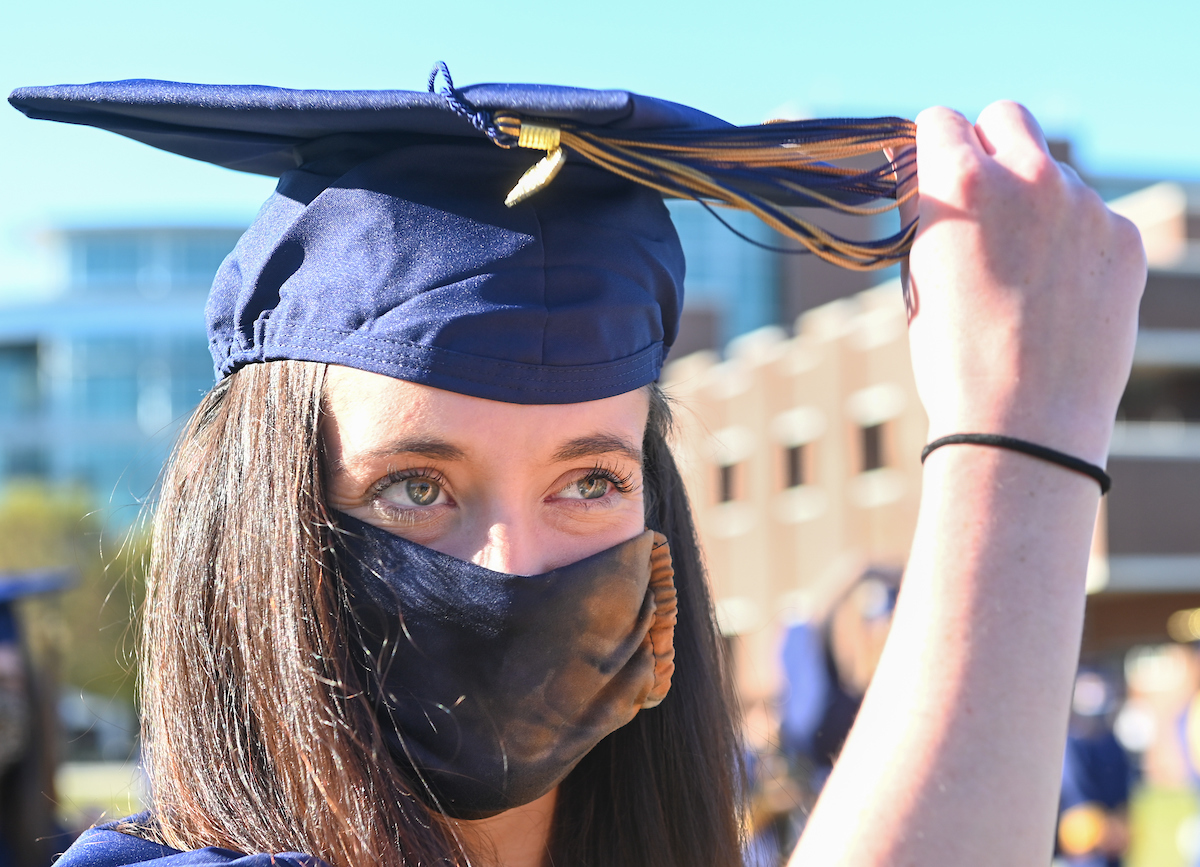Undergraduate students participate in a commencement ceremony on Friday, Nov. 20, 2020 on Chamberlain Field.
