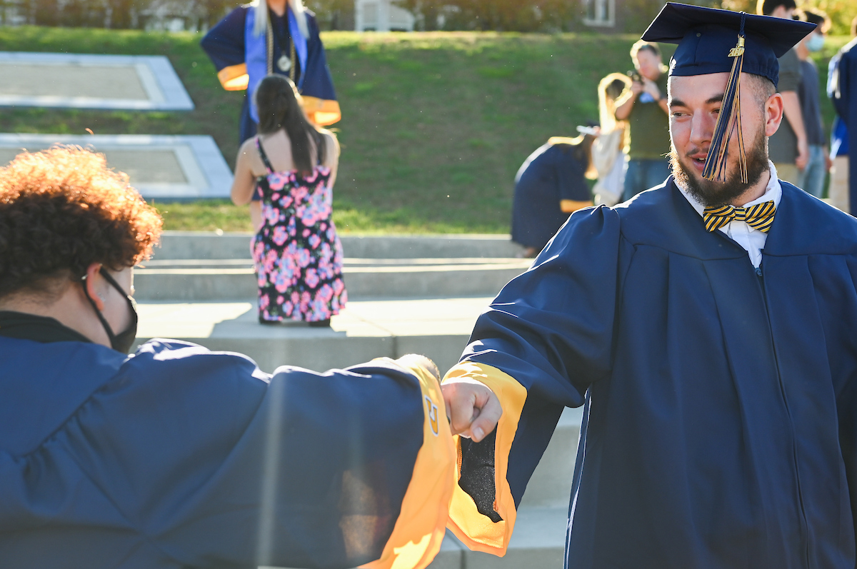 Undergraduate students participate in a commencement ceremony on Friday, Nov. 20, 2020 on Chamberlain Field.
