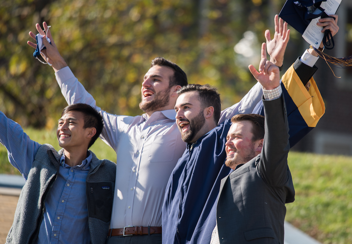 Undergraduate students participate in a commencement ceremony Saturday, Nov. 21, 2020 on Chamberlain Field.