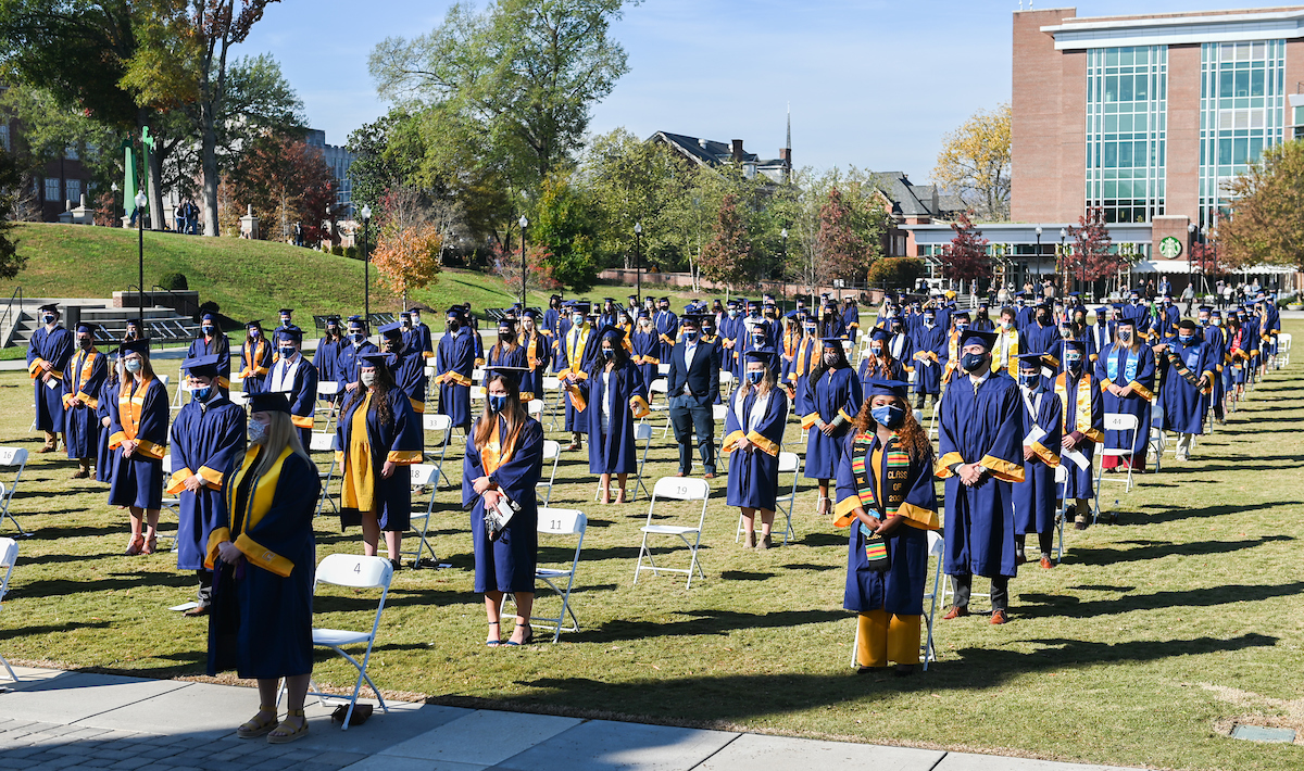 Undergraduate students participate in a commencement ceremony Saturday, Nov. 21, 2020 on Chamberlain Field.