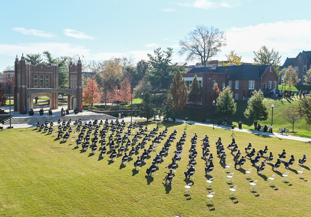 Undergraduate students participate in a commencement ceremony Saturday, Nov. 21, 2020 on Chamberlain Field.