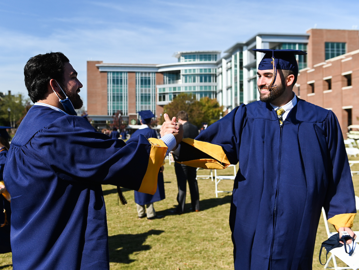Undergraduate students participate in a commencement ceremony Friday, Nov. 20, 2020 on Chamberlain Field.