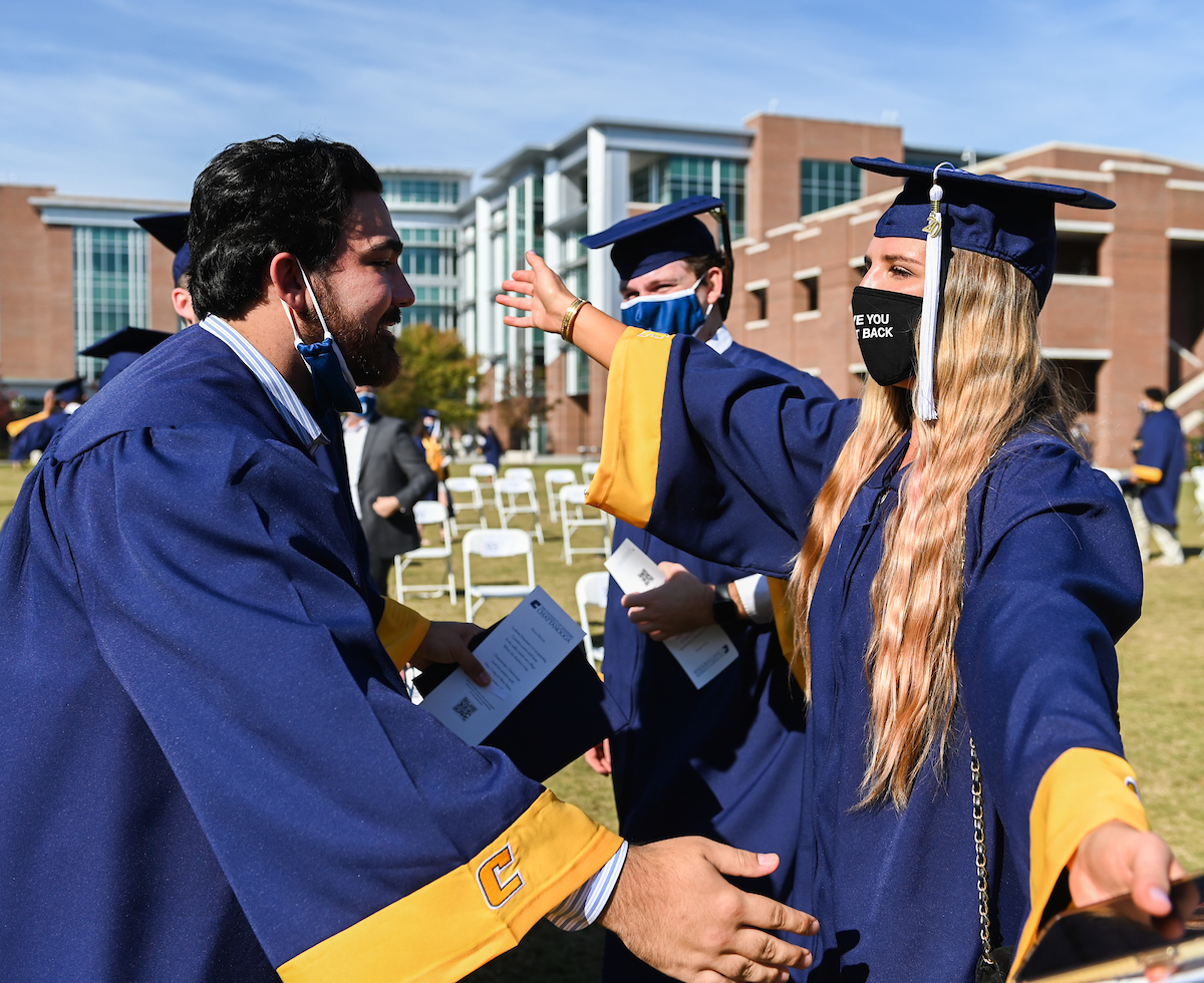 Undergraduate students participate in a commencement ceremony Saturday, Nov. 21, 2020 on Chamberlain Field.