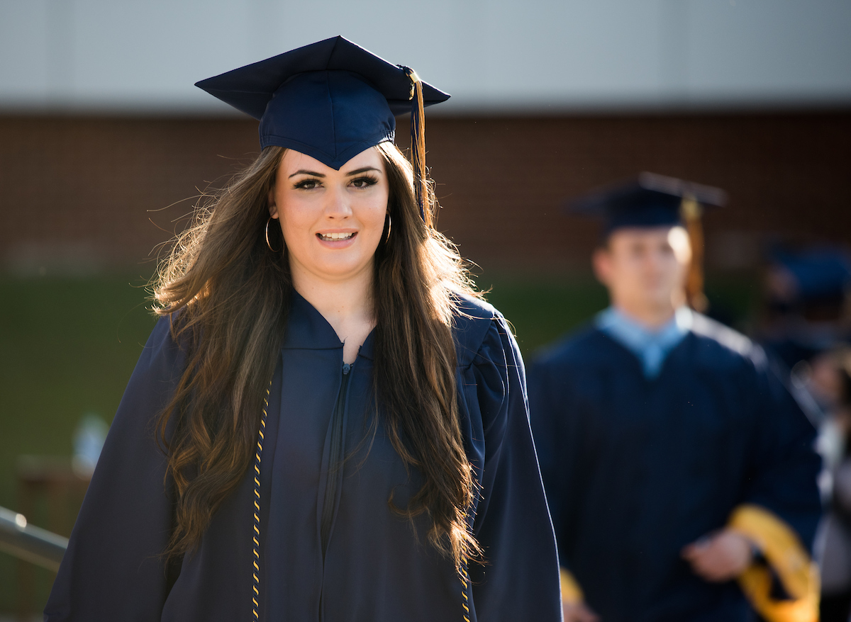 Undergraduate students participate in a commencement ceremony Saturday, Nov. 21, 2020 on Chamberlain Field.