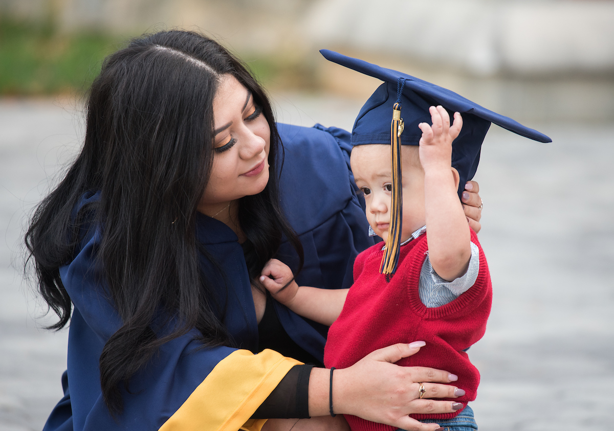 Undergraduate students participate in a commencement ceremony Saturday, Nov. 21, 2020 on Chamberlain Field.