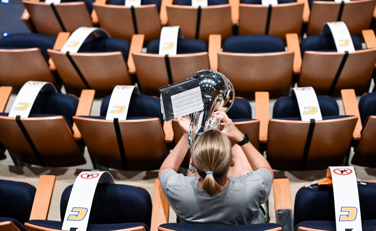 With social distancing tape in place, music students practice in the Roland B. Hayes Auditorium in the Fine Arts Center.