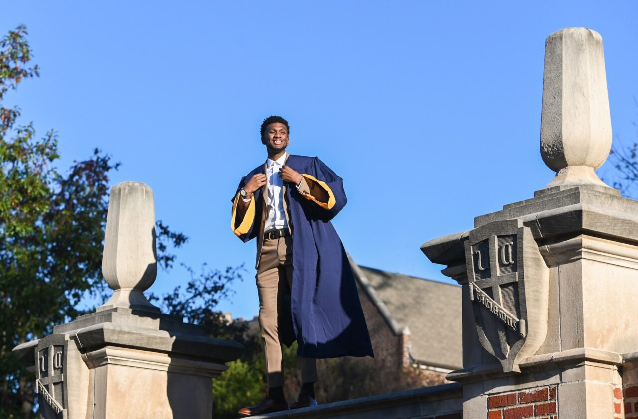 Graduate Brandon Love poses for photos on Nov. 19.