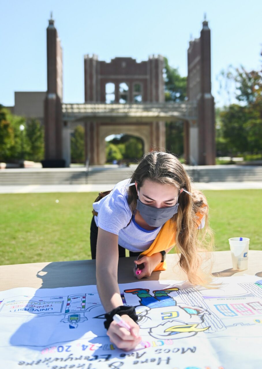 In October on Chamberlain Field, students colored banners for Homecoming Week.