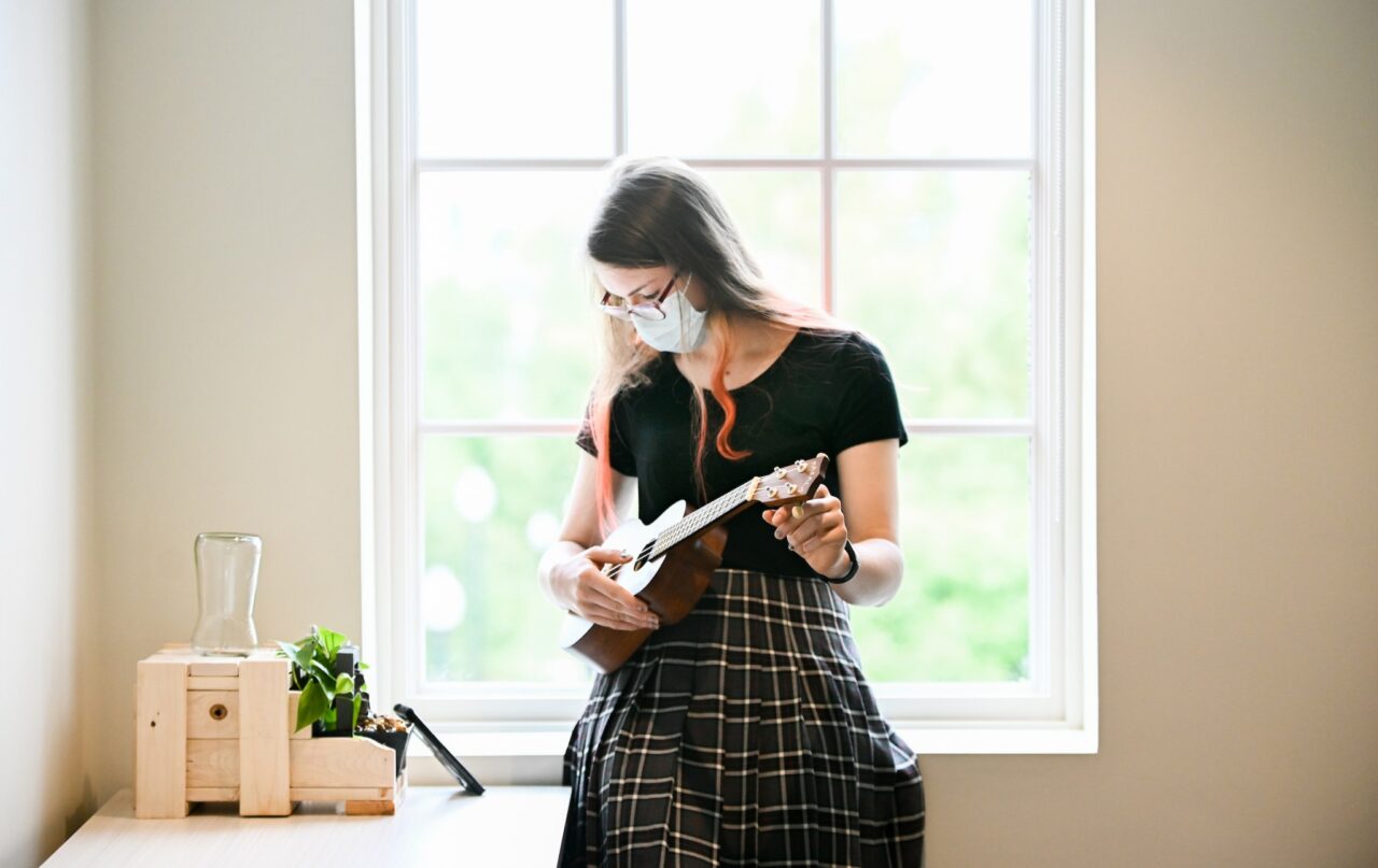 A ukelele is tuned befoe Angela Dittmar's Innovations class in August.