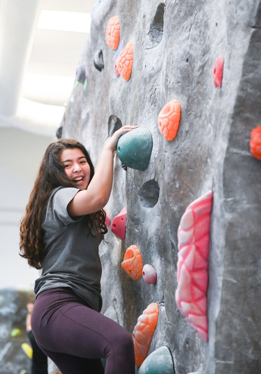Student members in Mocs LEAD (Leaders Encouraging A Difference) practice their climbing skills in the Aquatic and Recreation Center.
