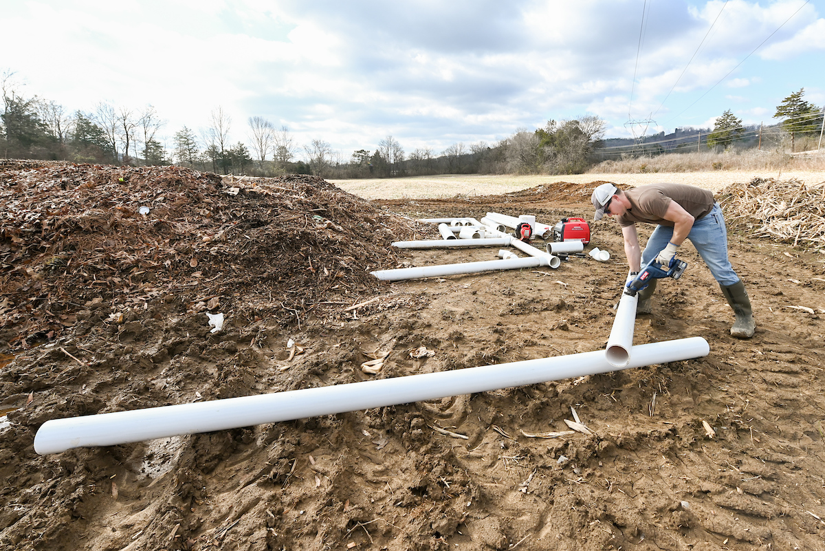 Oxygen must be pumped into the compost piles for the process.