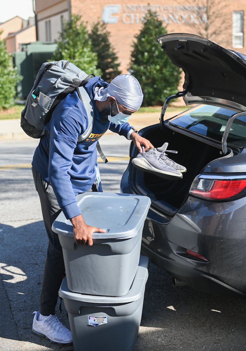 Daniel Brent emtpies his trunk of belongings as he returns to his room in Johnson Obear Apartments.