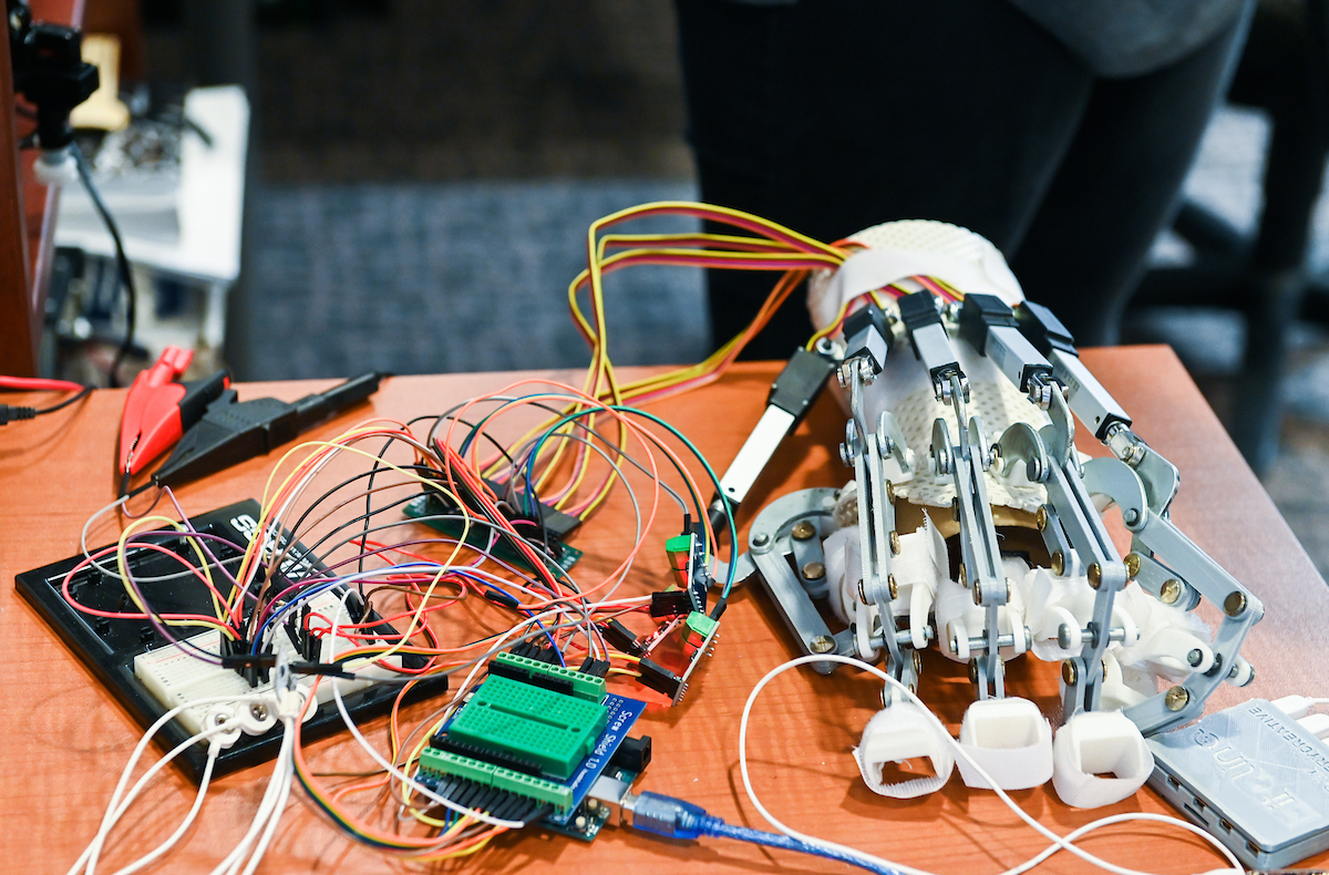 This robotic system is used for hand rehabilitation. Worn on a patient's paretic (partially paralyzed) hand, the system is driven by sensors on the forearm and can help rehabilitate the patient's ability to grasp.