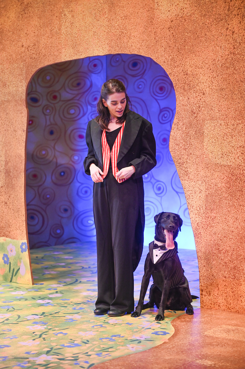An actor works with a dog Thursday, Feb. 25, 2021 in the Fine Arts Center.