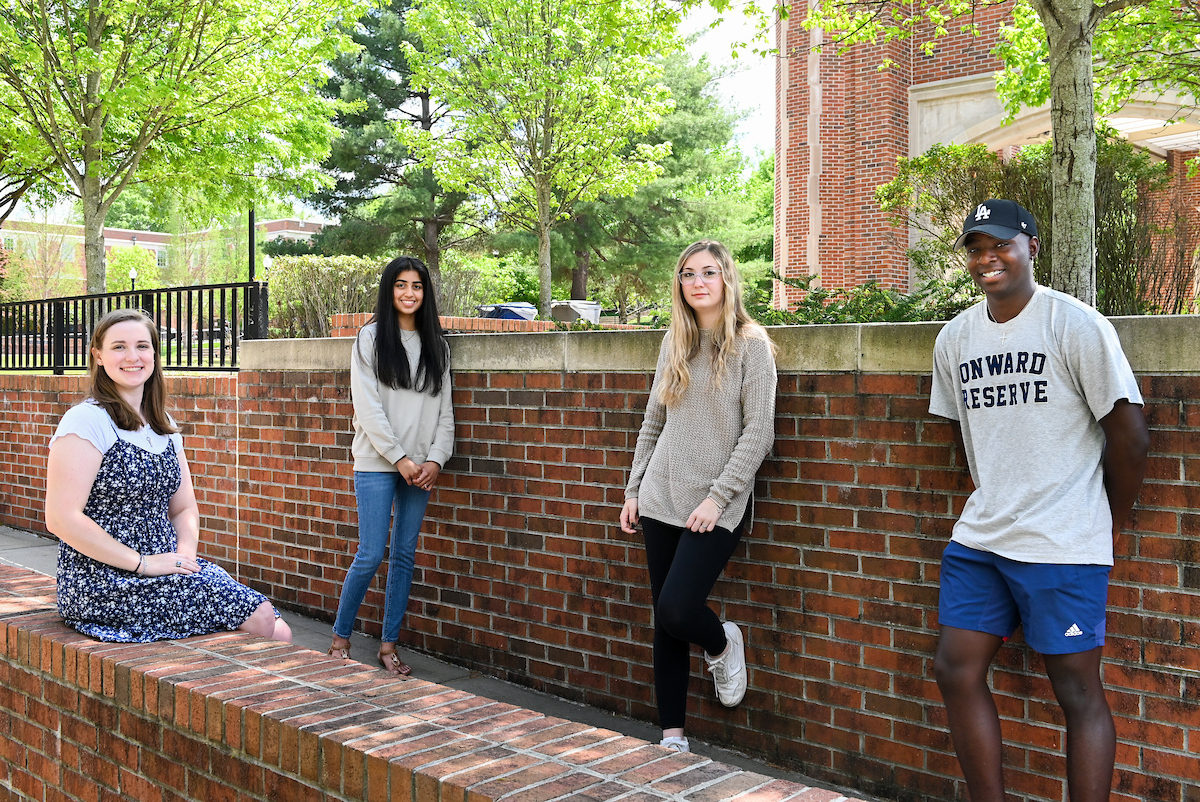Podcast class, Tuesday, April 20, 2021 on Chamberlain Field. (left to right) Podcast Producers: Jessica Cline, Shriya Purohit, Kassidy Robertson, and Gavin Collins