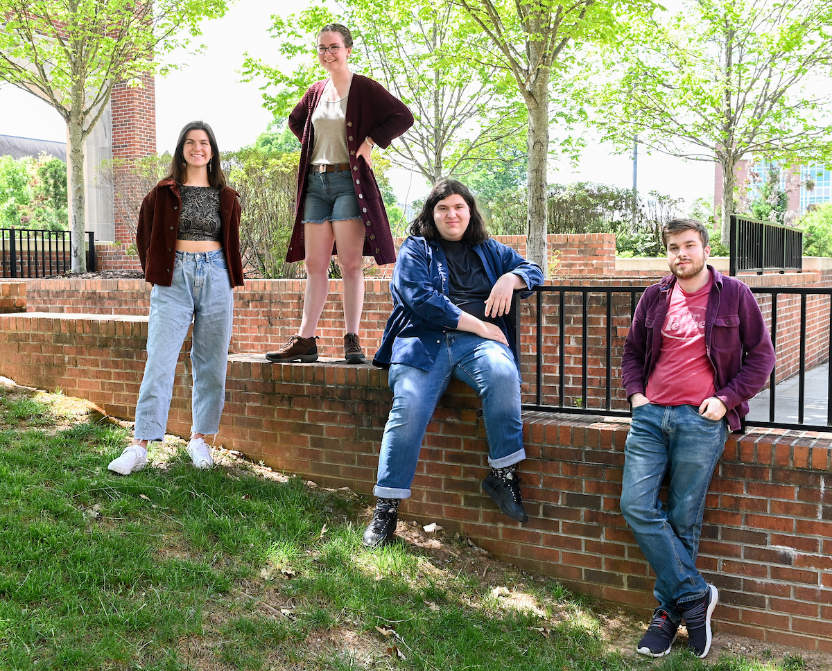 Podcast class, Tuesday, April 20, 2021 on Chamberlain Field. (left to right) Podcast Writers: Mazze Stokes, Sarah Simmons, Jude Keef, and Gabriel Pell