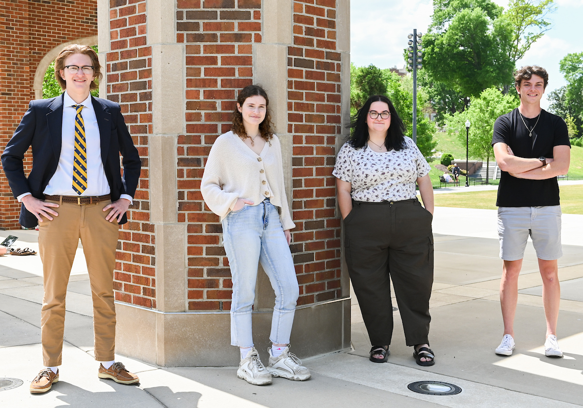 Podcast class, Tuesday, April 20, 2021 on Chamberlain Field. (left to right) Podcast Editors: Colin Thompson, Allison Mccollum, Marcella Rea, and Evan Britt