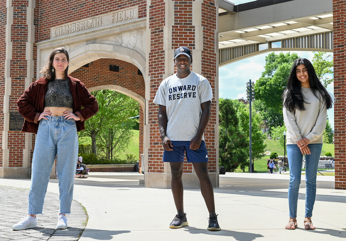 Podcast class, Tuesday, April 20, 2021 on Chamberlain Field. (left to right) Podcast Hosts: Mazze Stokes, Gavin Collins, and Shriya Purohit