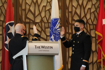 2nd Lt. Nicholas Chauncey recites his oath of office, given to him by Cpt. A.J. Herink.