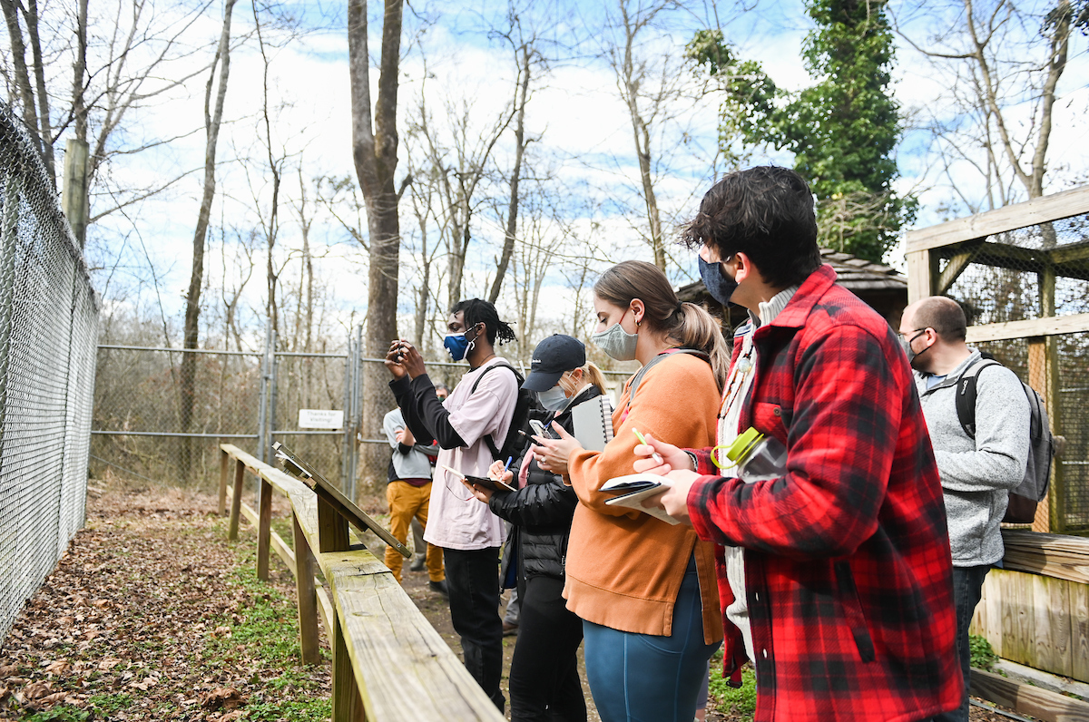 Students take notes on current signs at Reflection Riding.