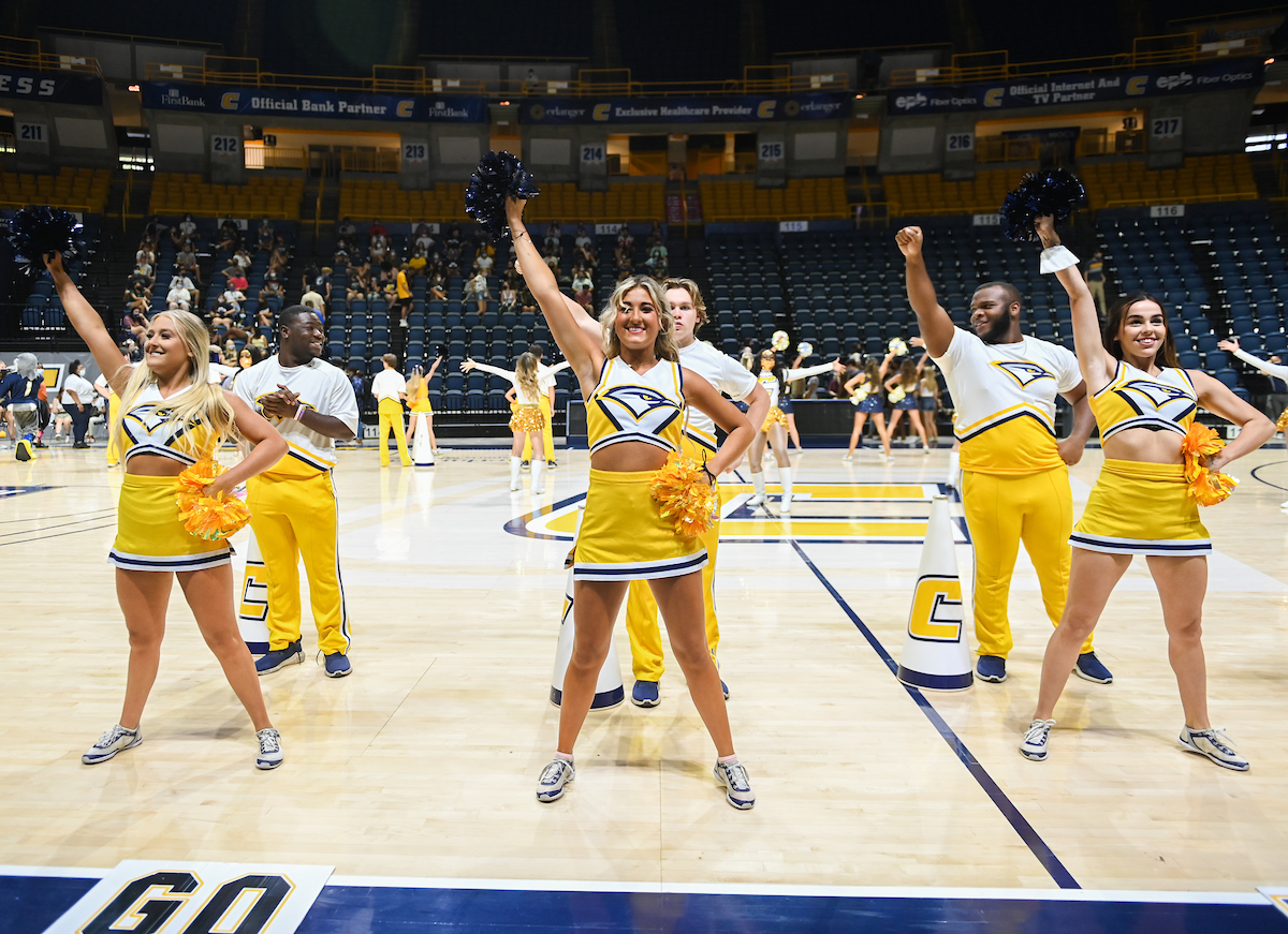 Cheerleaders perform on the McKenzie Arena floor.