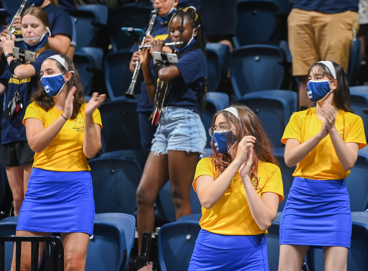 Marching Mocs members perform in the stands at the McKenzie Arena.