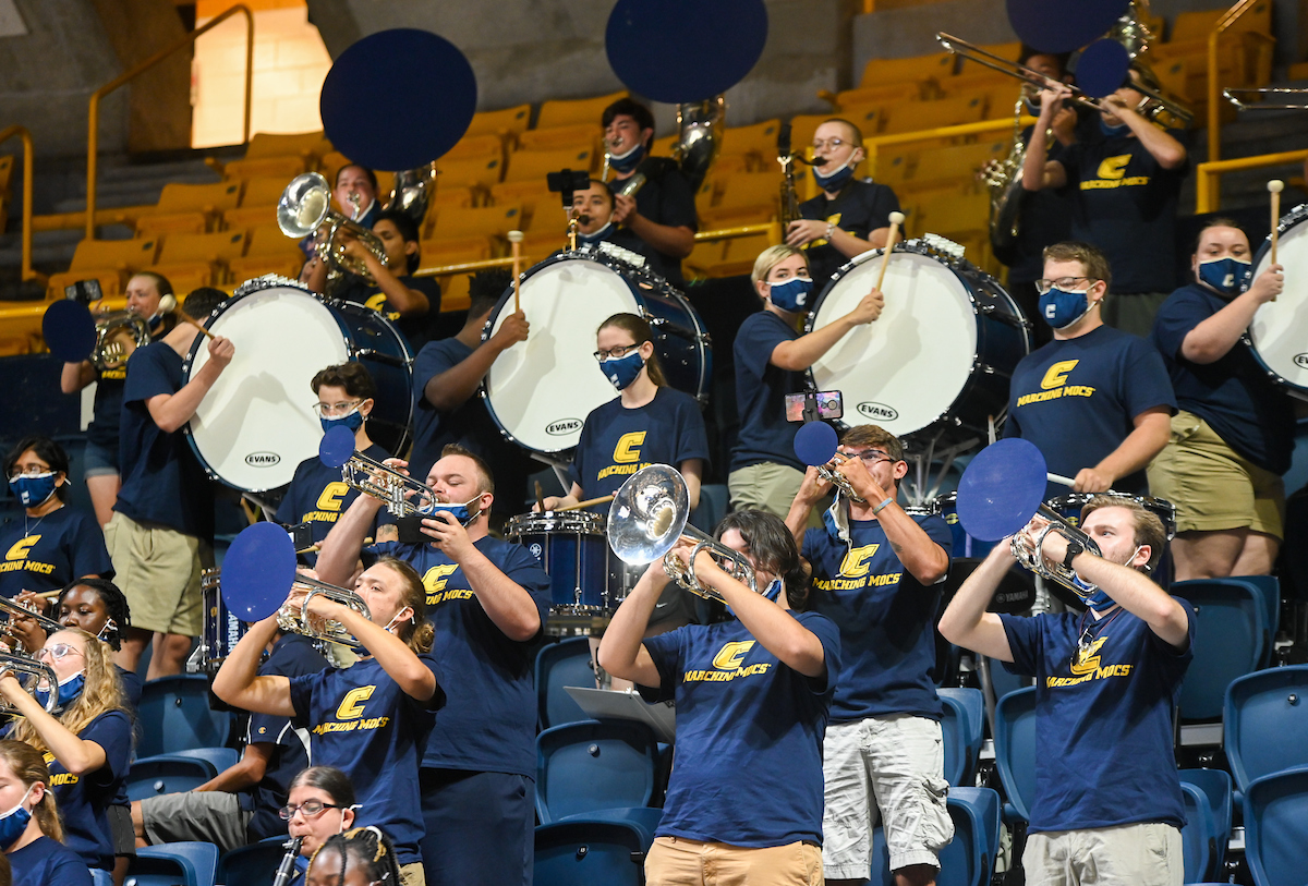 Marching Mocs perform in the stands at the McKenzie Arena.