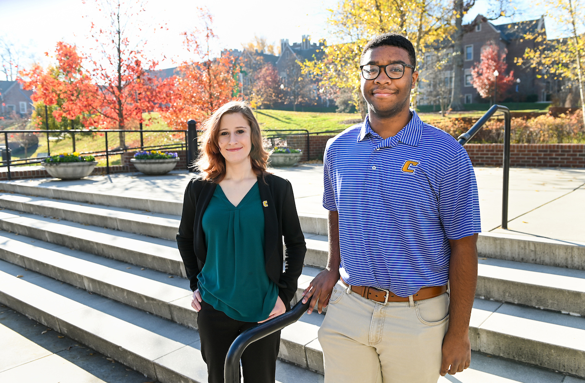 UTC students Nicki Messer and Miles Mosby stand in front of stairs on the UTC campus, December 3, 2021