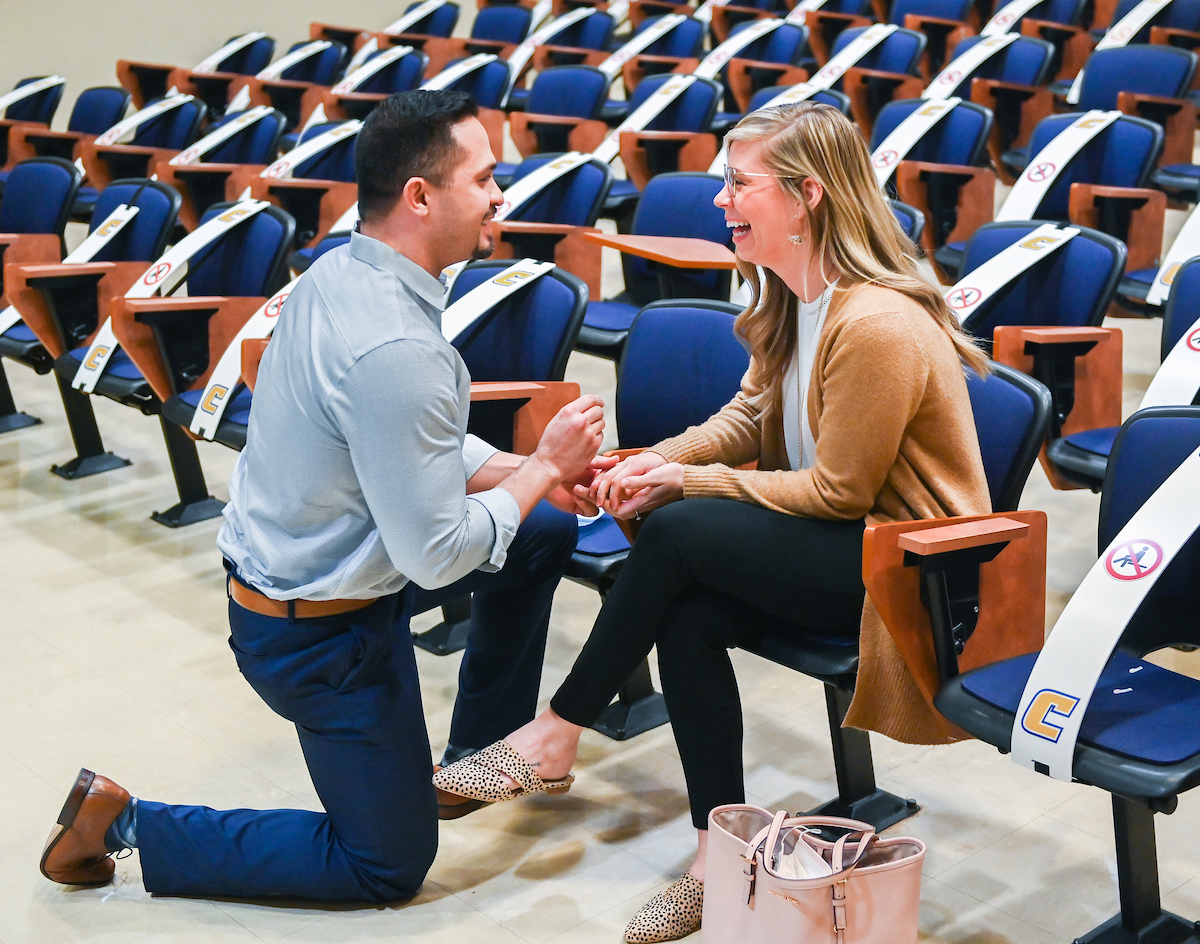 In a Grote Hall classroom where they first met, alumni Christopher Meugge asks long-time girlfriend Katie McGee to marry him.
