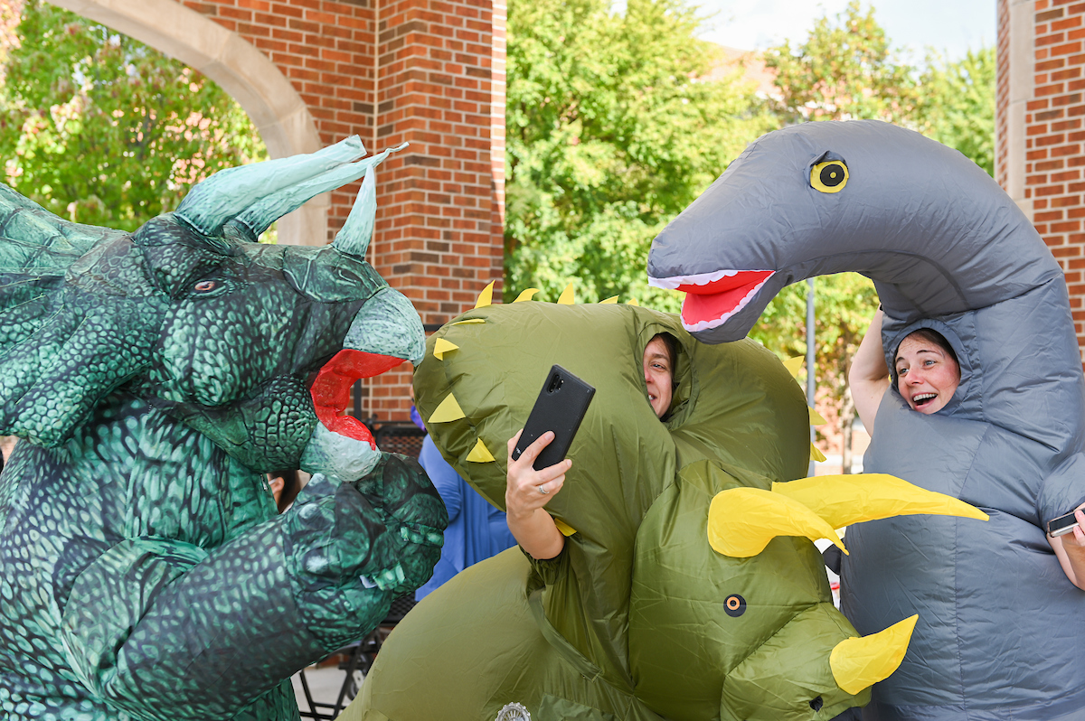 Professors Ashley Manning-Berg, Stephanie DeVries and Amy Brock-Hon, from left, don bulky animal costumes during the BGE (Biology, Geology and Environment Science) Fall Festival at Chamberlain Pavilion.